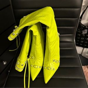 Neon green crocodile over the knee boots